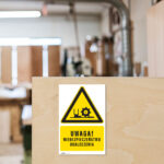 Tabliczka NIEBEZPIECZEŃSTWO OKALECZENIA - obrazek 2